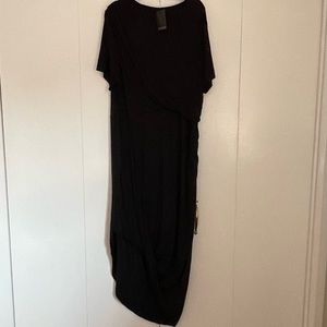 New! Black asymmetrical midi dress with ruching detail. Comfortable & stunning!